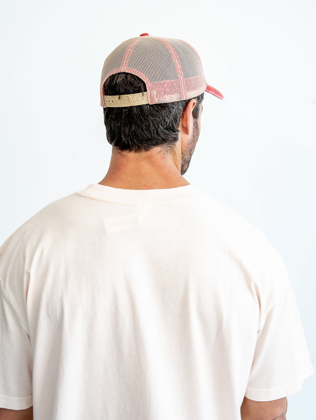 Back view of washed red and white cap