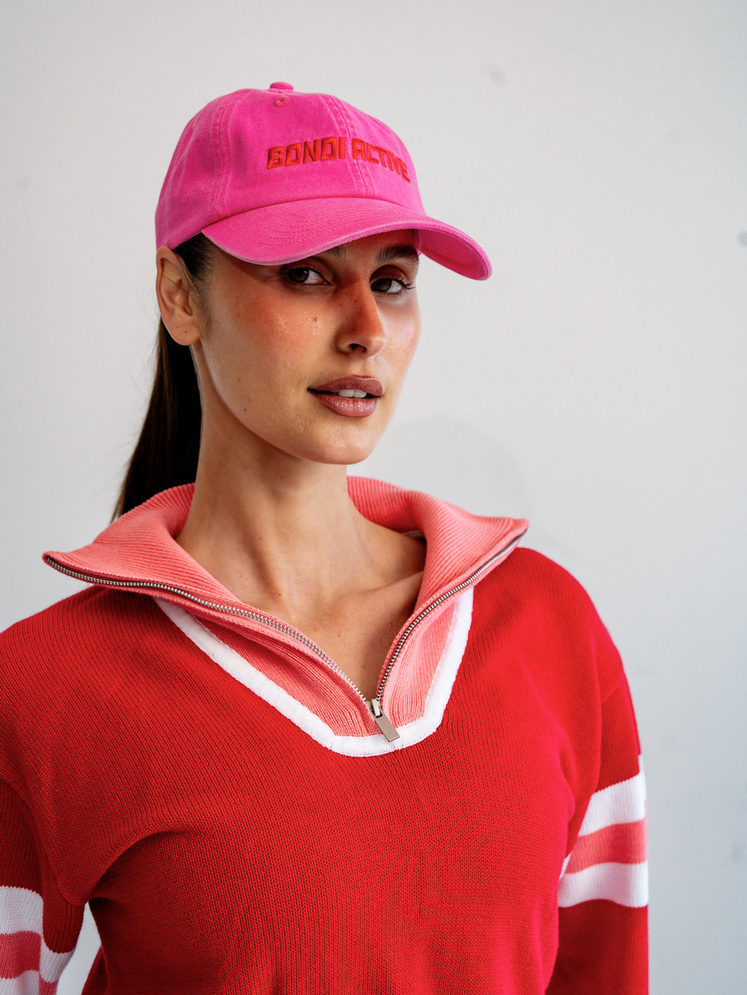 fuchsia pink and red cap front view