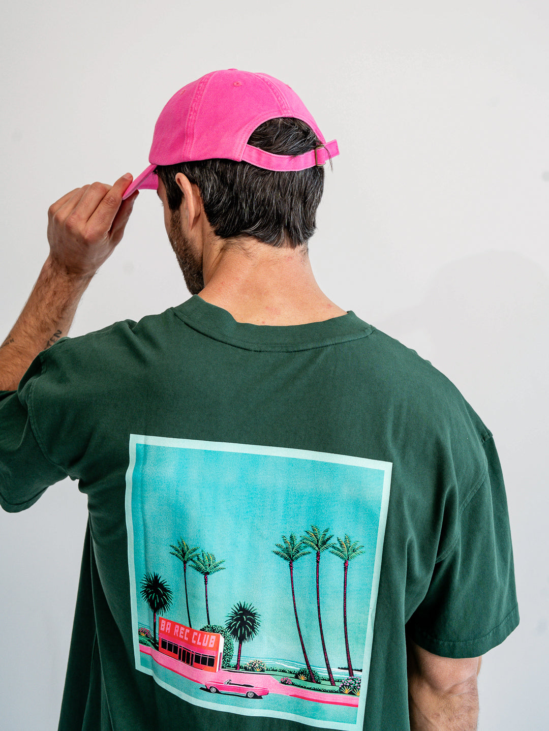 Back view of fuchsia pink and red cap