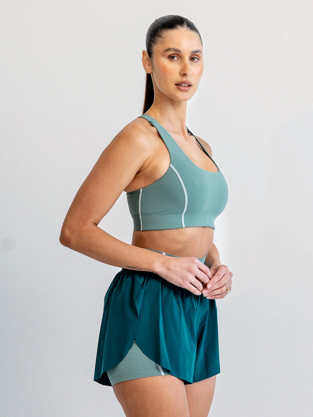 Side profile of Jade green high-support sports bra crop