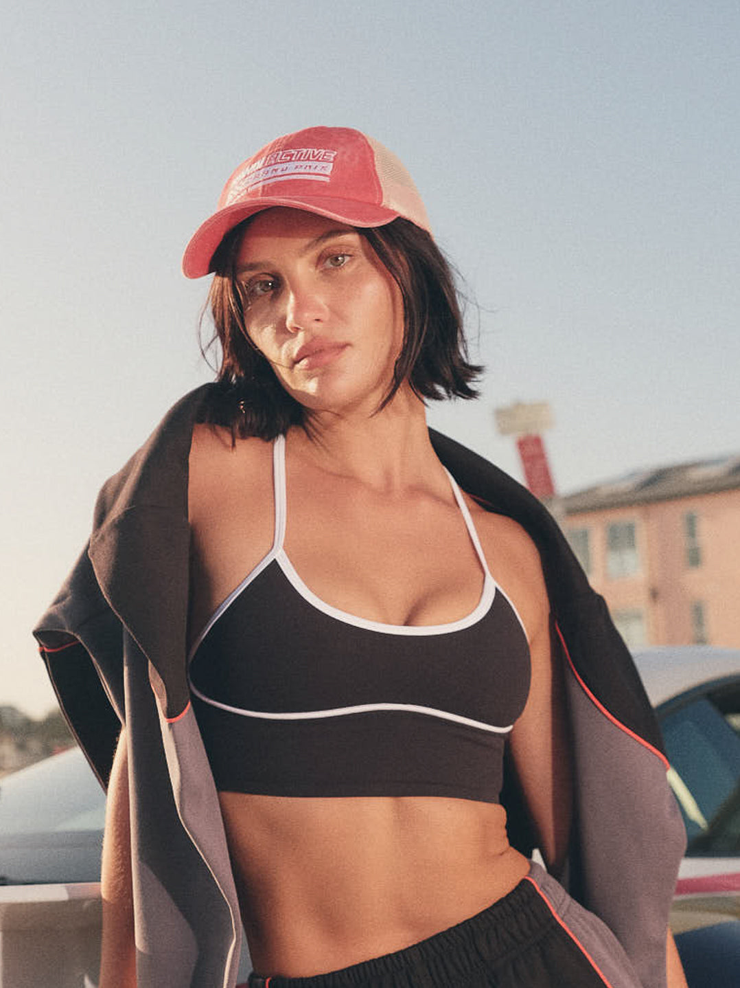 Model wearing washed red and white cap