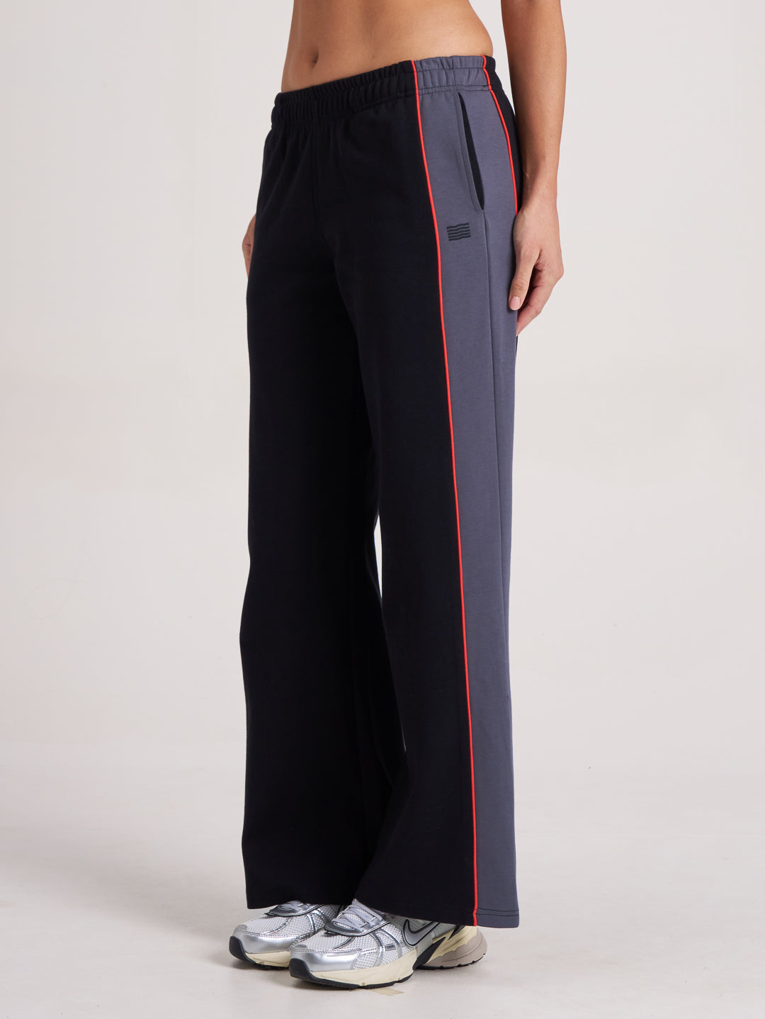 Side profile of black and grey wide leg pant