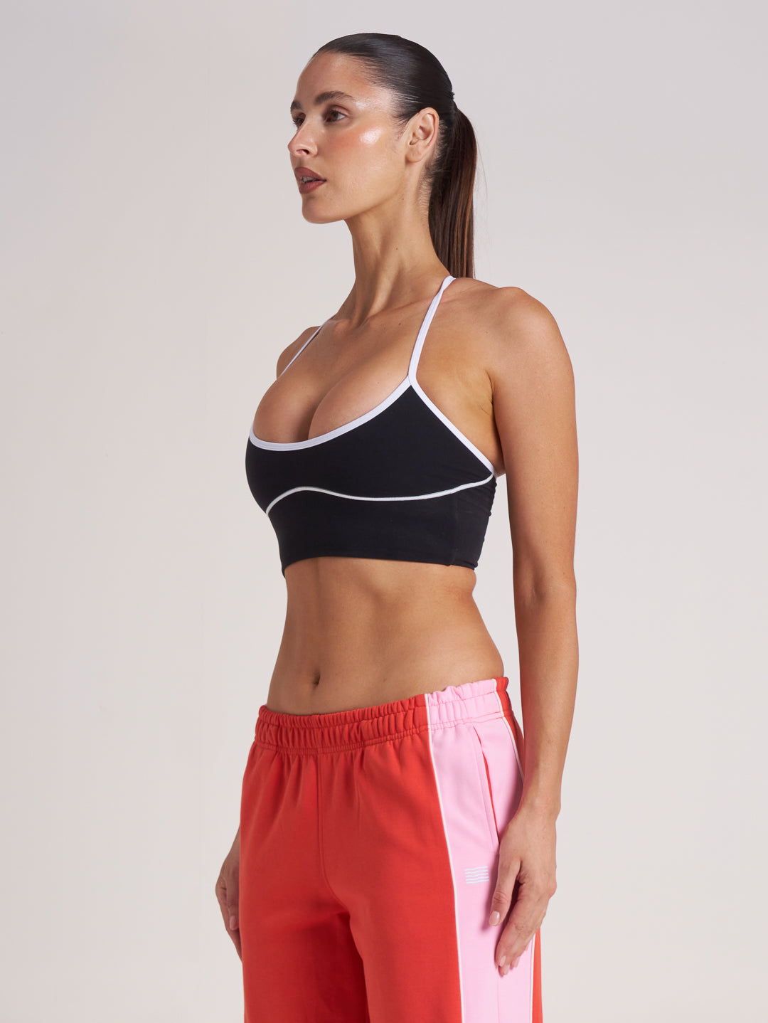 Side profile of black and white sports bra crop