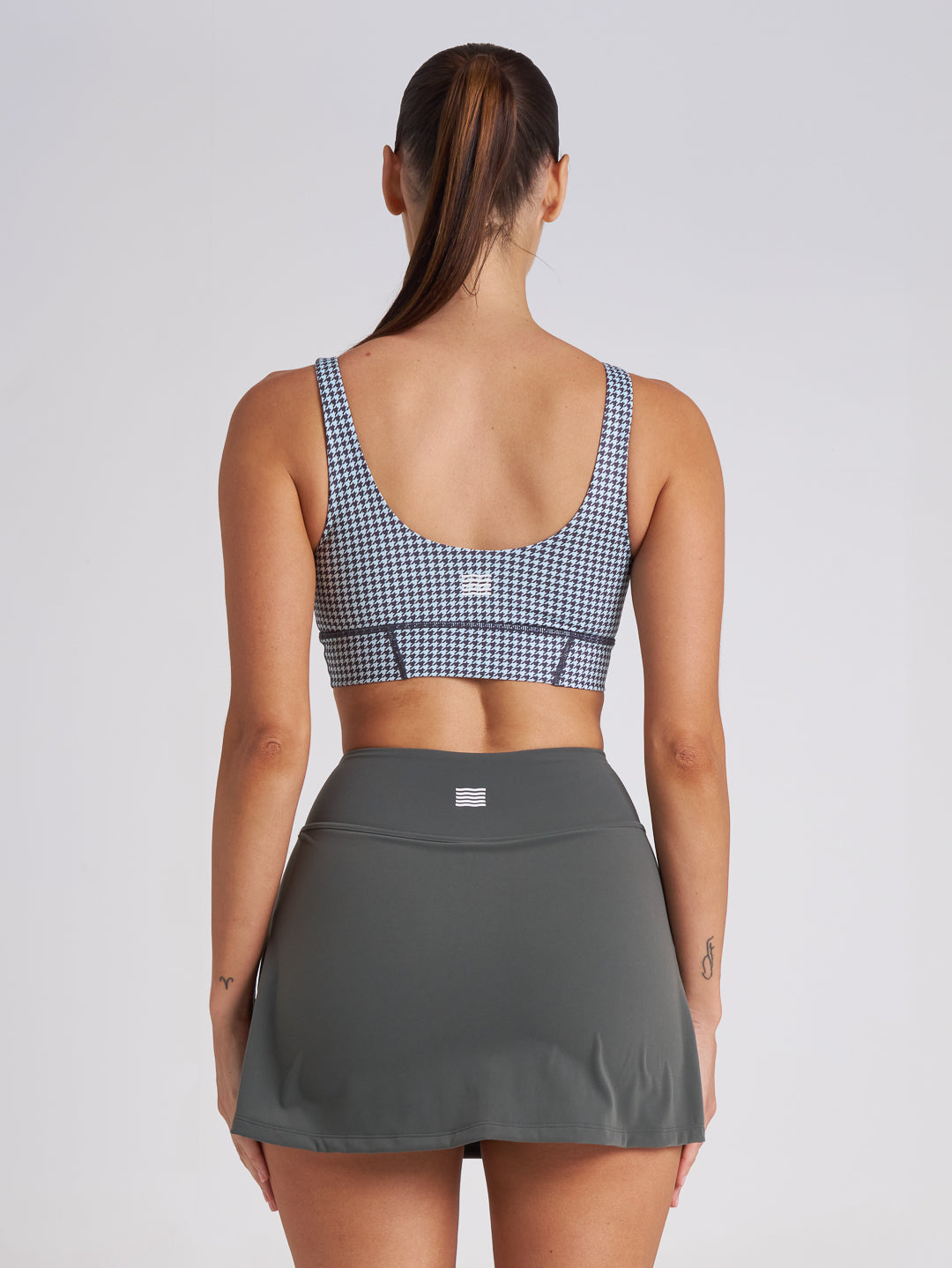 Back view of mini houndstooth sports bra crop