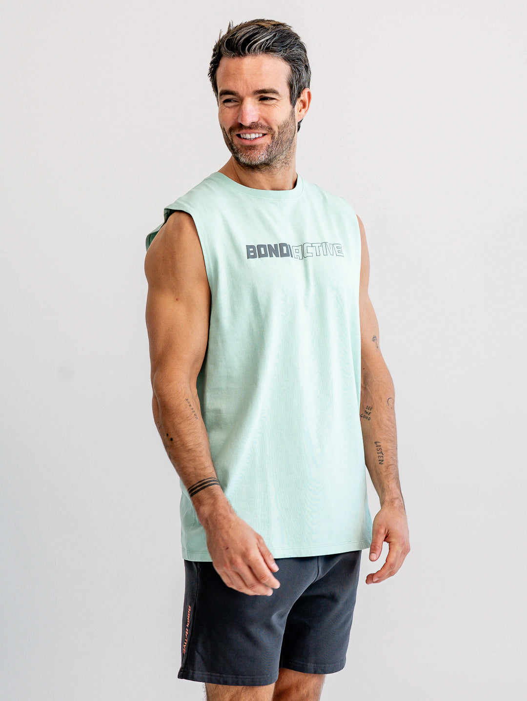 Side profile of mint green and asphalt grey tank top