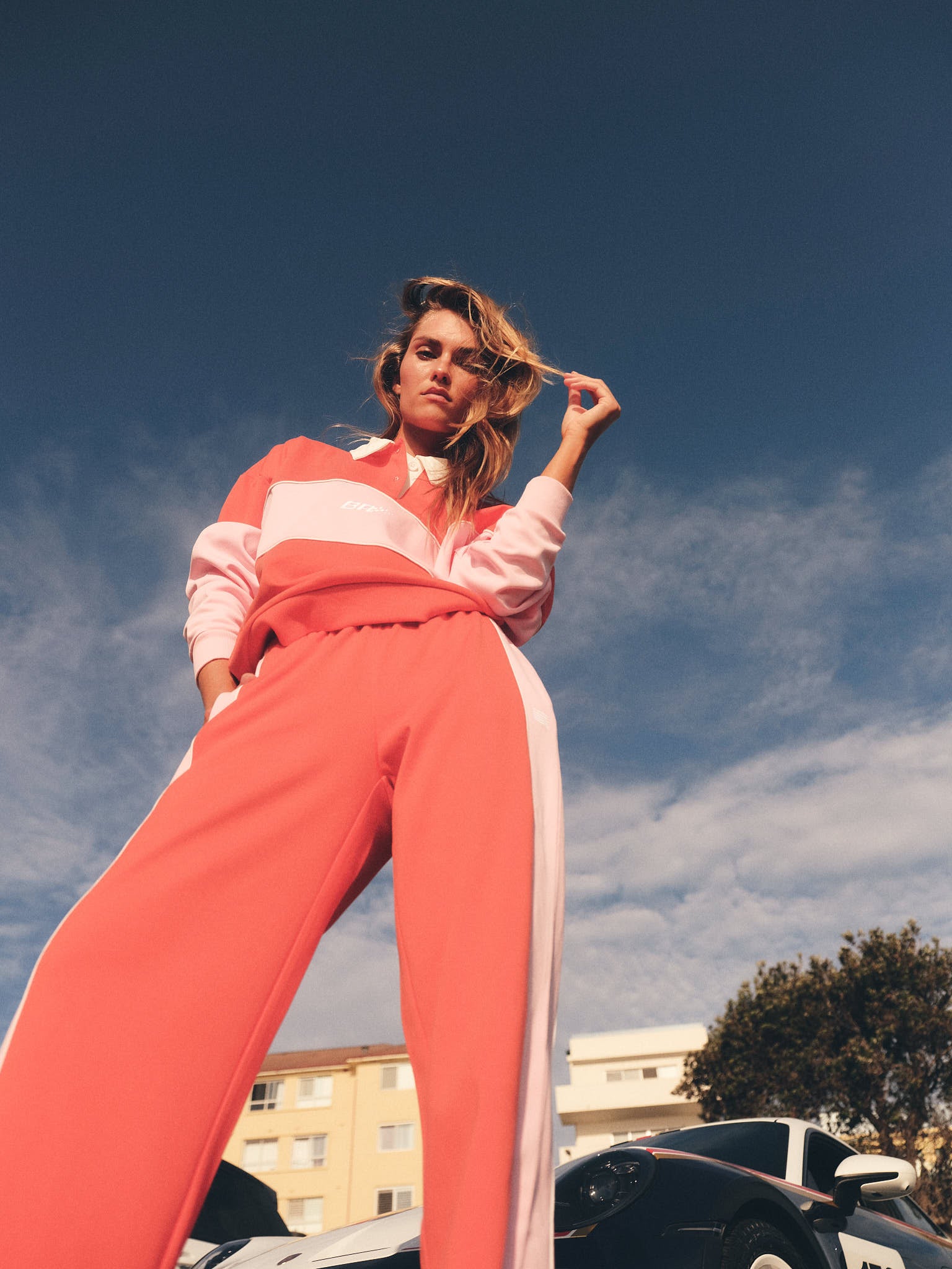 Close-up of tomato red and pink wide leg pant fabric texture